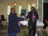 5 Dr Njenga giving charity to Church-Property aprox 0_25 acre1