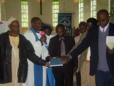 8 Dr Njenga dedicating an item to God1